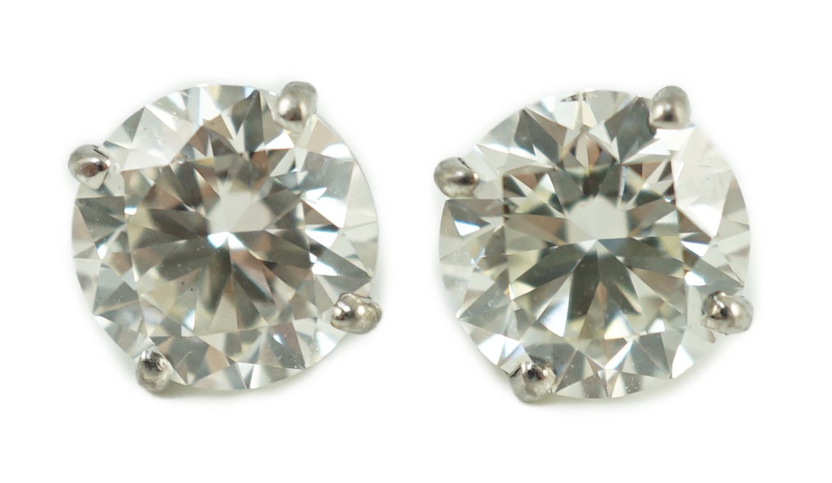 A pair of 750 white metal and solitaire diamond set ear studs, each stone weighing approximately 1.50ct